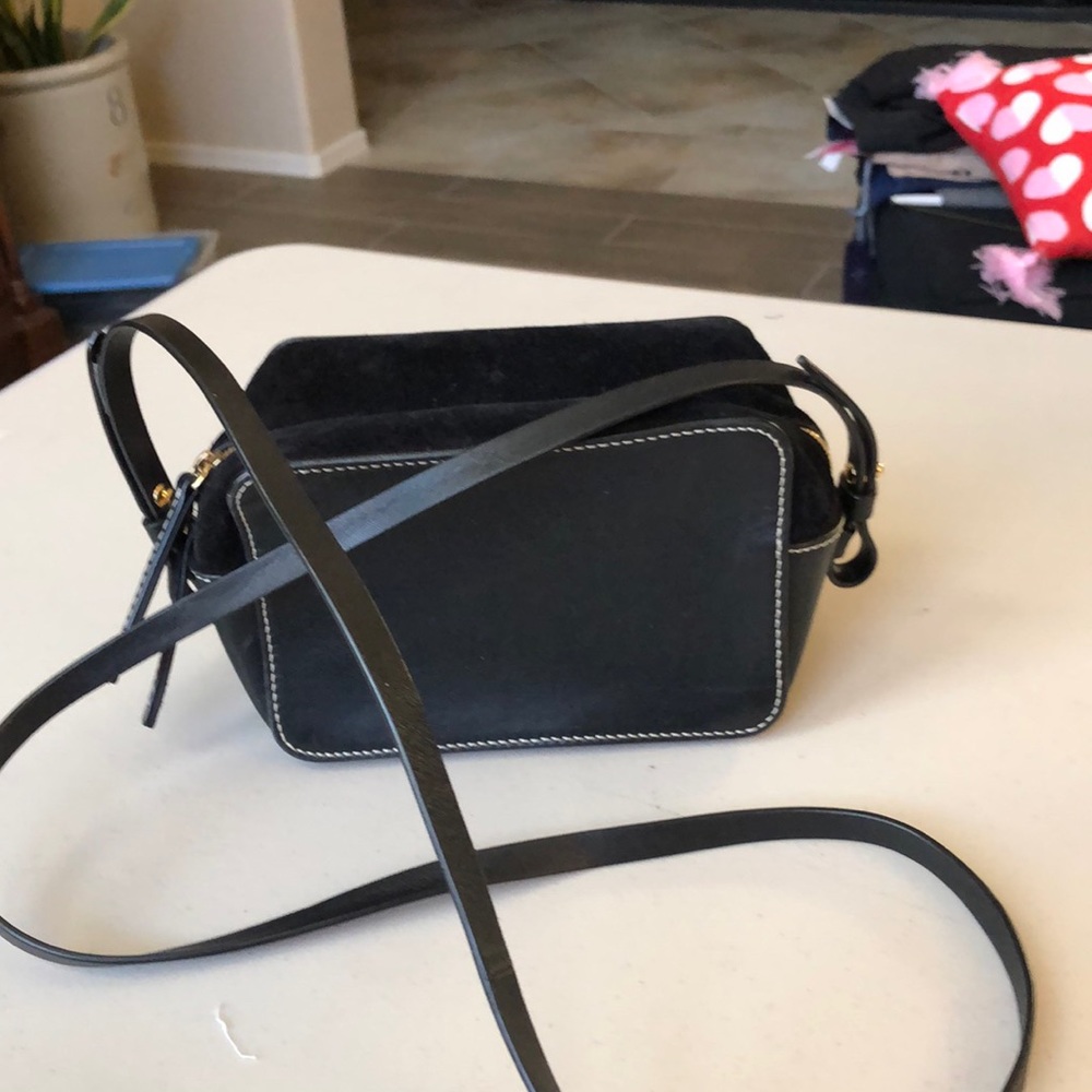 Vince leather and suede cross body bag in black.